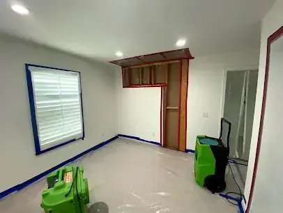Drying equipment set up in a room during a water damage dry-out