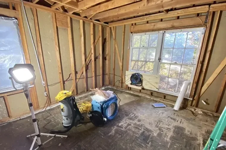 Flooded lower level of a home with drying underway