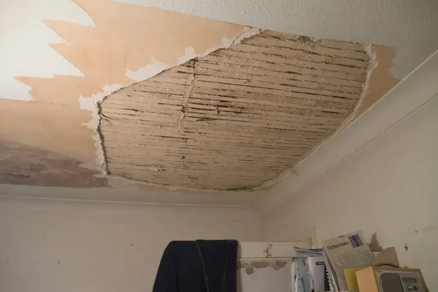 Sagging plaster ceiling in an older home after a roof leak